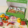 Variety of Mi Rancho products layed out with peppers and herbs on table